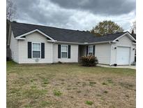 Charming single-story home with a well-maintained lawn and neutral siding at 429 Stephanie Dr, Goose Creek, SC 29445