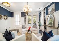 A beautifully decorated living room showcases stylish furniture, lighting, and elegant design elements at 155 Village Ponds Dr, Summerville, SC 29483