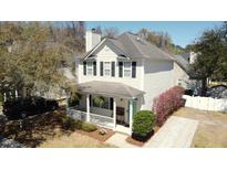 Charming two-story home features a covered front porch, landscaped yard, and private driveway at 2369 Chadbury Ln, Mount Pleasant, SC 29466