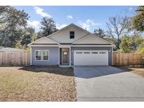 Charming single-Gathering home with a two-car garage and well-maintained front yard at 409 Klein St, Walterboro, SC 29488