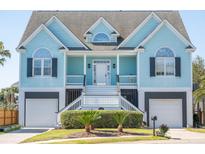 Charming two-story beach house with symmetrical design, inviting front steps, and beautiful curb appeal at 2107 Club View Ct, Charleston, SC 29412