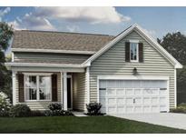 Charming one-story home featuring a 2-car garage, manicured lawn, and beautiful architectural details at 315 Quiet Cove Trl, Summerville, SC 29486