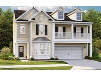 Charming two-story home with a welcoming front porch and a well-manicured lawn at 531 Verdi Dr, Summerville, SC 29486