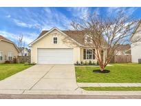 Charming single-Gathering home with manicured lawn and two car garage in a suburban neighborhood at 7120 Sweetgrass Blvd, Hanahan, SC 29410