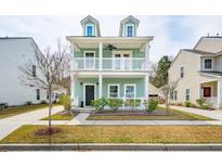 Charming two-story home featuring a double balcony and well-maintained landscaping at 1651 Valley Oak Rd, Johns Island, SC 29455