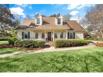 Charming single Gathering home with a cozy front porch and manicured landscaping at 19 Fitzroy Dr, Charleston, SC 29414