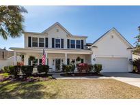 Charming two-story home with a covered front porch and manicured landscaping at 2052 Bancroft Ln, Mount Pleasant, SC 29466