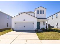 Charming two-story home featuring white siding, a two-car garage, and a well-maintained front yard at 538 Spanish Wells Rd, Summerville, SC 29486