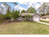 Charming home featuring an attached garage and a well-maintained lawn with mature trees at 7 Briarcliff Dr, Charleston, SC 29407