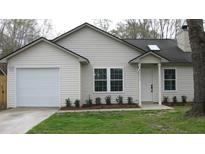 Charming single-story home with a well-maintained lawn, a one car garage, and vinyl siding at 8311 Whitehaven Dr, North Charleston, SC 29420