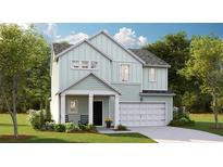 Charming two-story home featuring a two-car garage, welcoming front porch, and light green siding at 118 Moscato Ln, Summerville, SC 29485