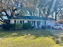 Charming single-story home with brick exterior and well-maintained lawn at 4228 Oakridge Dr, North Charleston, SC 29418