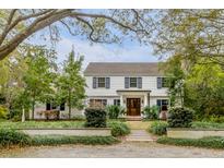 Stunning two-story home with manicured front yard and mature trees at 7 Guerard Rd, Charleston, SC 29407