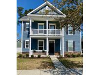 Charming two-story home with a welcoming front porch and blue siding at 1659 Seabago Dr, Charleston, SC 29414