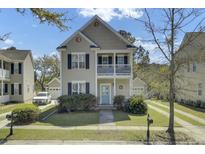 Charming two-story home with a front porch and a well-maintained landscaped yard at 1844 Hubbell Dr, Mount Pleasant, SC 29466