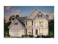 Charming two-story home featuring a welcoming entrance, balcony, and attached garage at 2074 Cousteau Ct, Johns Island, SC 29455