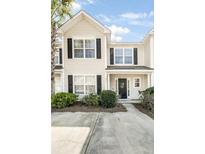 Charming townhome with black shutters, tidy landscaping, and a welcoming entrance at 8842 Gable St, North Charleston, SC 29406