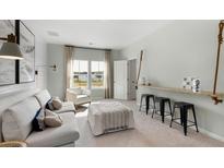 Bright living room featuring a comfortable sofa, natural light, and stylish decor at 114 Snow St, Summerville, SC 29486