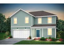 Charming two-story home featuring light blue siding, a welcoming porch, and a two-car garage at 739 Meadowbrook Ln, Summerville, SC 29486