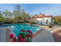 Relaxing community pool with inviting blue water and poolside lounge chairs at 1223 Telfair Way Way, Charleston, SC 29412