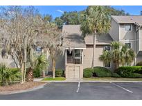 Inviting condo with palm trees and beautiful landscaping at 157 High Hammock Villas, Seabrook Island, SC 29455