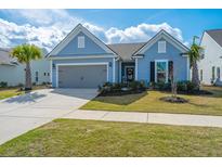 Charming single-story home with a well-maintained lawn, two-car garage, and inviting curb appeal at 159 Garden Gate Way, Summerville, SC 29486