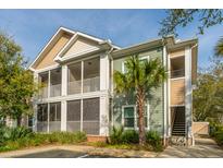 Attractive two-story condo with screened patios, green and beige siding, and mature landscaping at 1755 Central Park Rd # 3102, Charleston, SC 29412