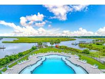 Stunning pool and lounge area overlooking the marsh with picturesque views at 110 Tidewater Way, Charleston, SC 29492