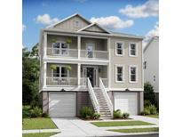 Charming two-story home featuring double balconies, a two car garage and elevated entry stairs at 1679 Cultivation Ln # 459, Mount Pleasant, SC 29466