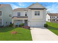 Charming two-story home with a well-manicured lawn and inviting curb appeal at 2901 Backman St, Mount Pleasant, SC 29466