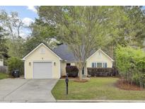 Charming single-story home with a well-manicured lawn, attached garage, and mature trees offering shade at 304 Arbor Oaks Dr, Summerville, SC 29485