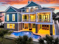 Beautiful backyard featuring a sparkling pool and a cozy outdoor lounge area at 2777 Oak Manor Dr, Mount Pleasant, SC 29466