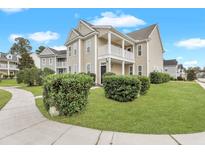 Charming two-story home with well-manicured lawn and inviting front porch at 154 Old Jackson Rd, Goose Creek, SC 29445