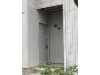 Unit front door with coded access in neutral painted wood building at 201 Greenmeadow Dr, Goose Creek, SC 29445