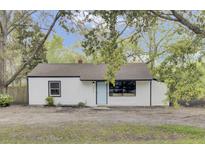 Charming renovated home with a light blue door and updated windows at 2916 Louise Dr, North Charleston, SC 29405
