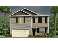 Charming new construction two-story home with gray siding, black shutters, an attached garage, and manicured landscaping at 262 Wild Strawberry Ln, Moncks Corner, SC 29461