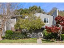 Charming gray two-story home with mature trees and landscaped front yard at 404 Ventura Pl, Mount Pleasant, SC 29464