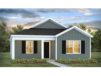 Charming single-story home with gray siding, black shutters, and well-manicured lawn, perfect for modern living at 131 River Hill Rd, Goose Creek, SC 29445