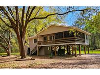 Charming two-story home featuring a screened-in porch, natural light and inviting outdoor spaces at 217 Brick Rd, Walterboro, SC 29488