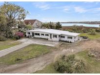 Stunning waterfront home featuring a clean design, beautiful landscaping, and serene water views at 4701 Apple St, North Charleston, SC 29405