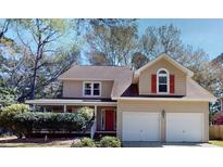Charming two-story home with attached two-car garage and inviting front porch at 2071 Middleburg Ln, Mount Pleasant, SC 29464