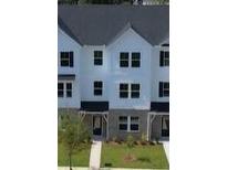 New construction townhouse with black shutters and sidewalk to the covered entry at 5108 Double Eagle Lp, Summerville, SC 29485
