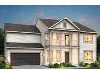 Charming two-story home featuring a front balcony and an attached garage, perfect for suburban living at 1069 Island Preserve Rd, Johns Island, SC 29455