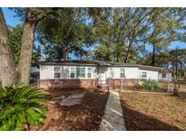 Charming single-story home featuring a brick foundation and a well-manicured front yard at 20 Stratton Dr, Charleston, SC 29420