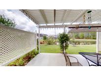 View of the patio with a view of the pond, landscaping, and lights at 3069 Memorial Dr, Charleston, SC 29414