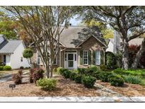 Charming brick home with green shutters and a well-manicured front yard at 956 Provincial Cir, Mount Pleasant, SC 29464
