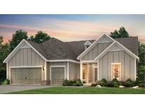 Charming single-story home featuring board and batten siding, an attached two-car garage, and a well-manicured lawn at 1172 Island Preserve Rd, Johns Island, SC 29455