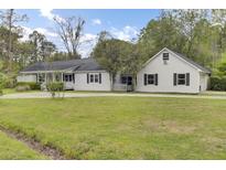 Charming single-story home with a well-maintained lawn and inviting curb appeal at 509 Hill St, Moncks Corner, SC 29461