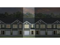 Charming new townhomes feature attached garages and inviting architectural details at 136 Haventree Ct, Summerville, SC 29486