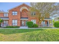 Charming brick townhome with well-manicured lawn and inviting front porch at 1421 Dove Run Dr # C, Charleston, SC 29412